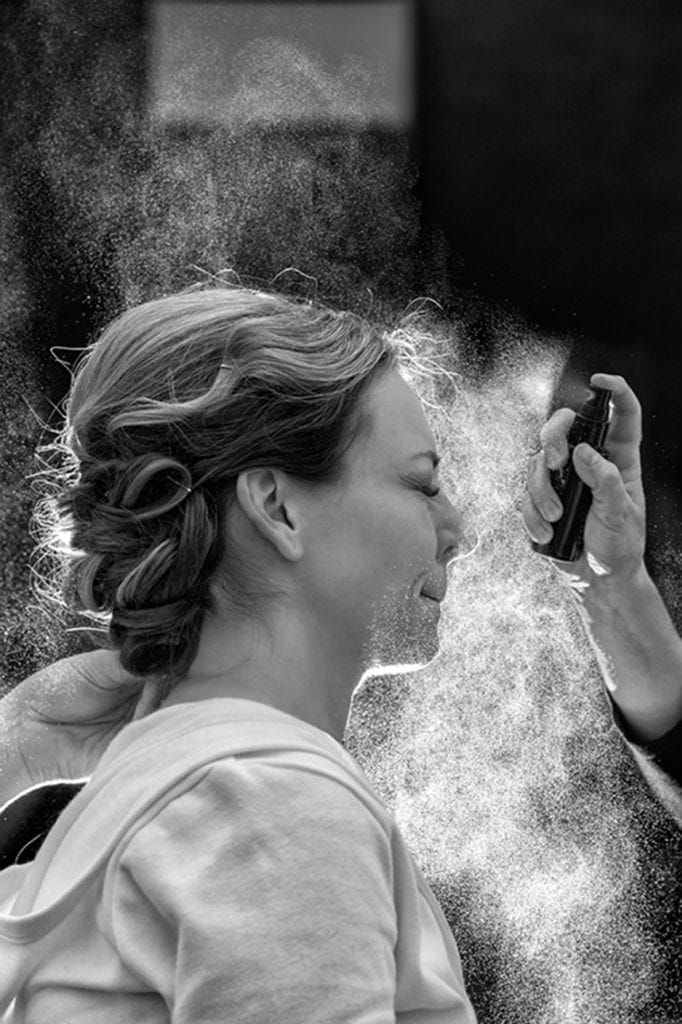 bride gettin hair sprayed
