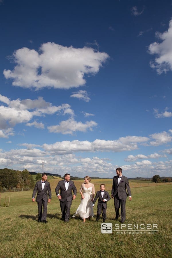 groomsmen walking with bride at breitenbach
