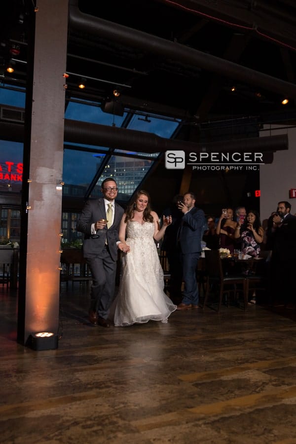bride and groom enter their wedding reception atmusic box supper club