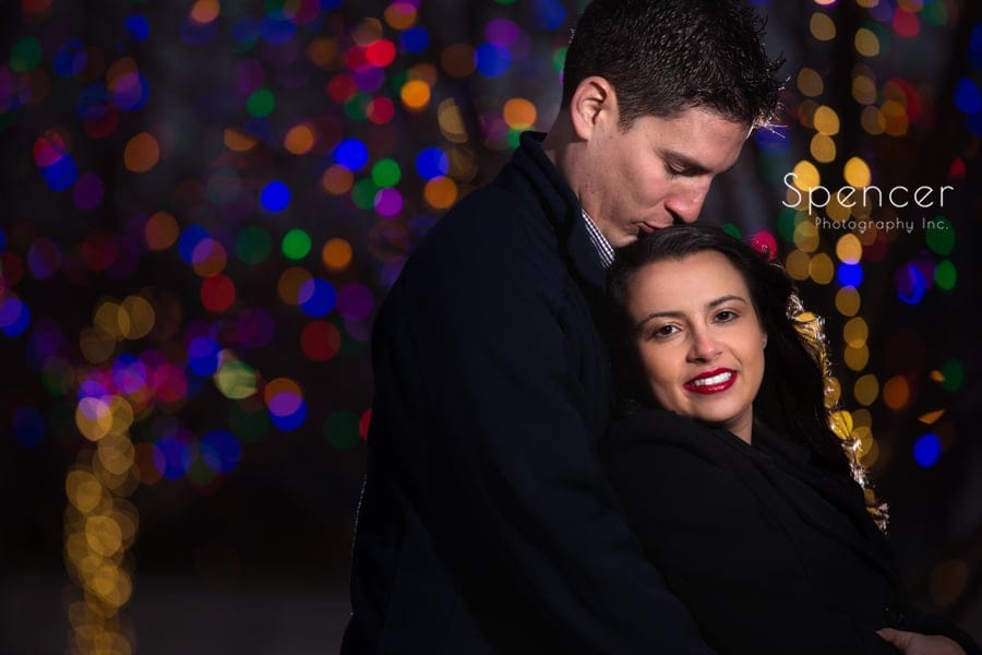 Ray kidding Nancy's head during engagement picture in public square