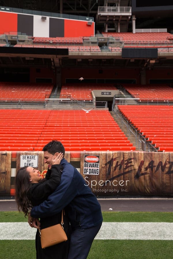 They kiss after the ring is on her finger