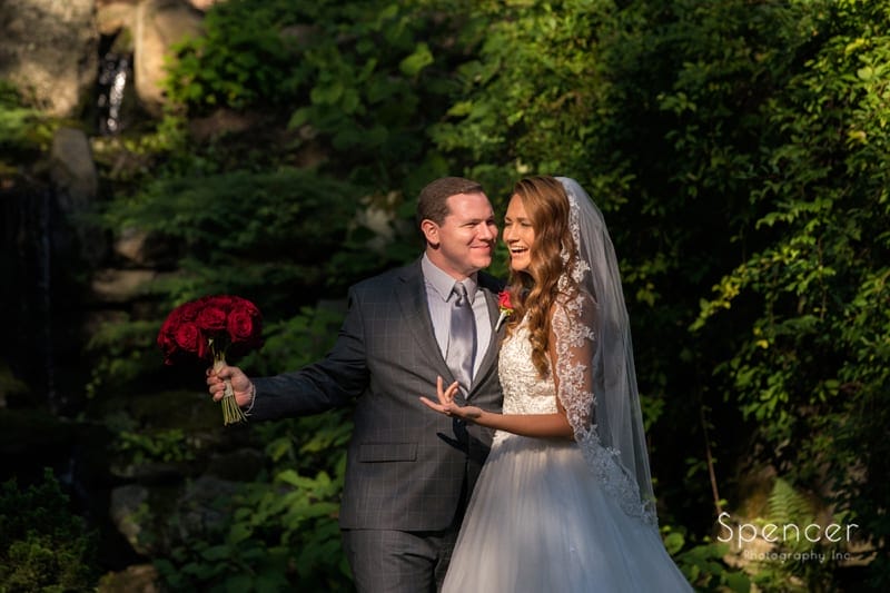 bride and groom having fun at stan hywet wedding