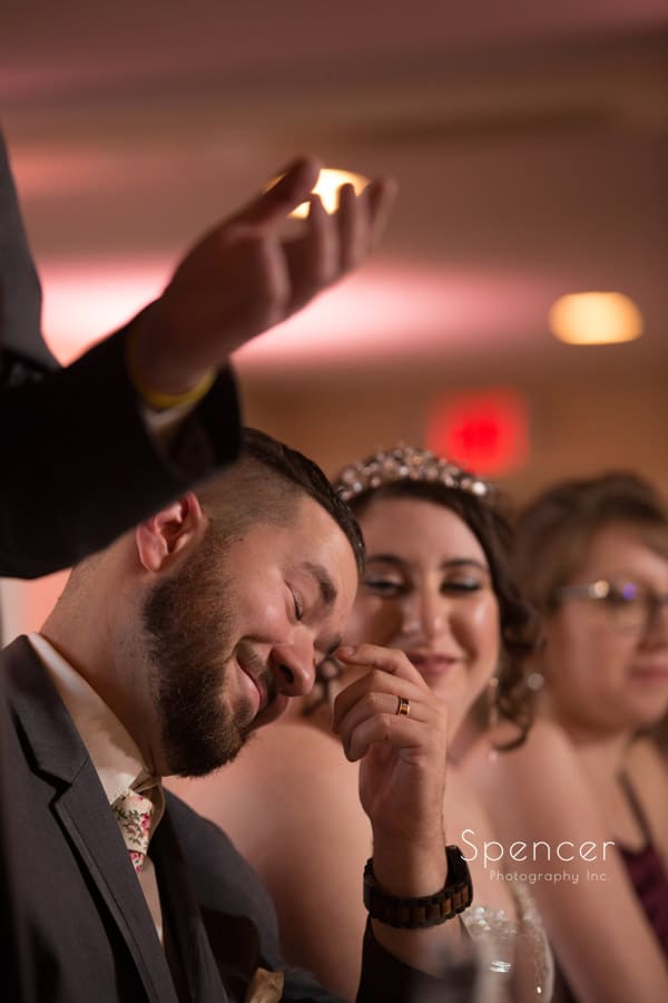 groom reacting to best man speech at shady hollow country club reception