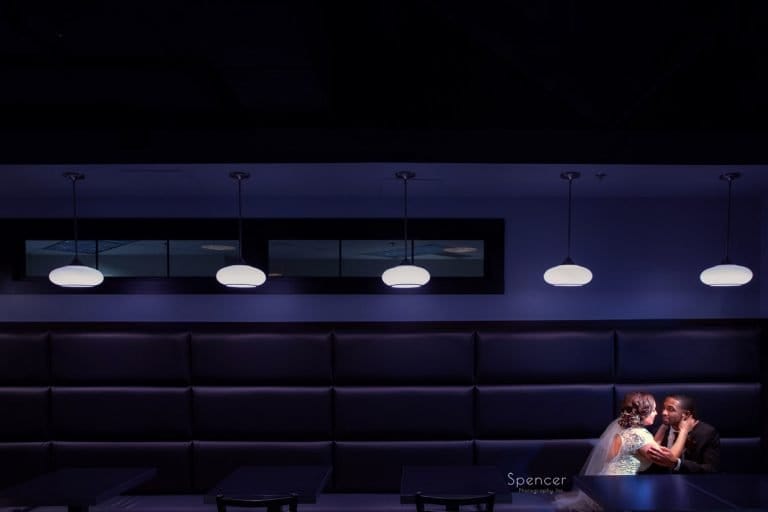couple kissing on wedding day in Cleveland café