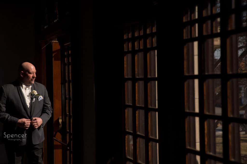 wedding picture of groom in doorway of Lakewood United Methodist Church