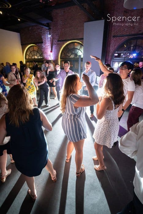 reception guests dancing at Windows on the River