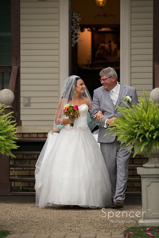 dad walking bride to her wedding at Country Cottage and Gardens