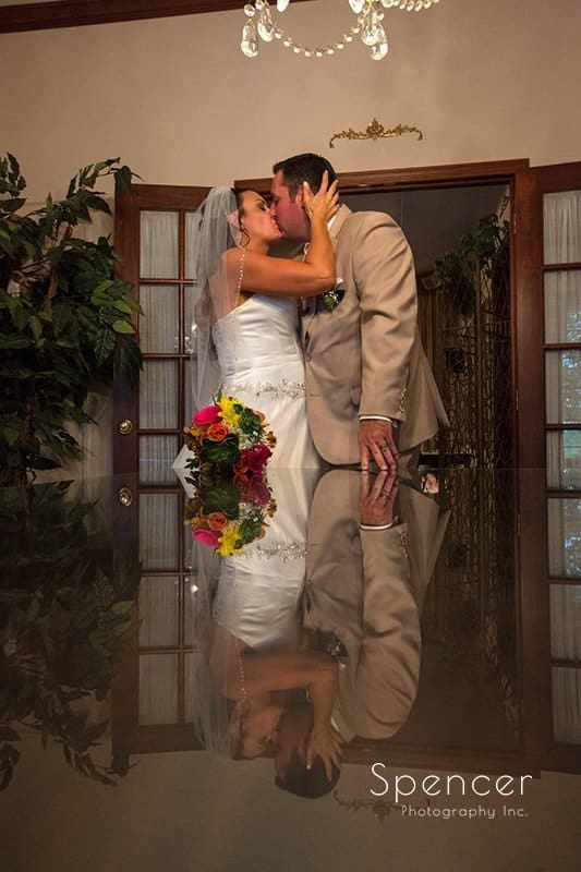 wedding picture of bride and groom kissing at Country Cottage and Gardens Canton