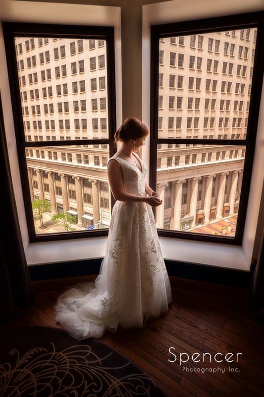 Bride standing in Cleveland Kimpton Schofield Hotel on wedding day