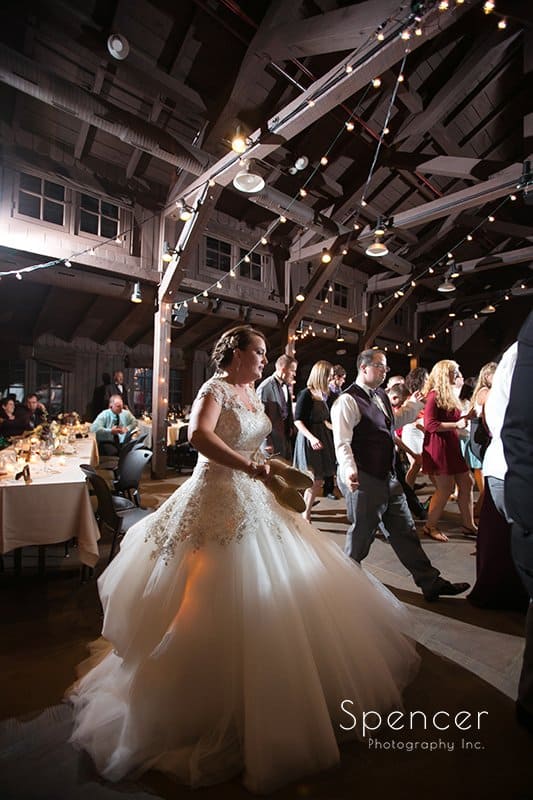 bride dancing at her wedding reception at Happy Days Lodge