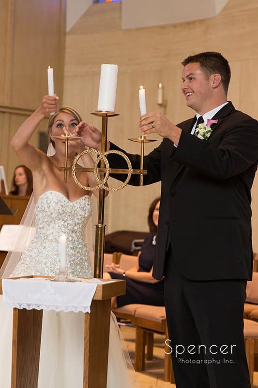 bride and groom lighting unity candle