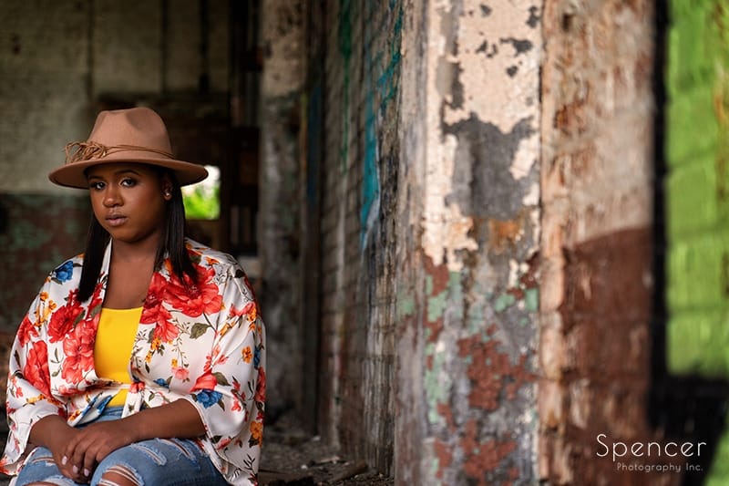 senior girl sitting in downtown Cleveland warehouse