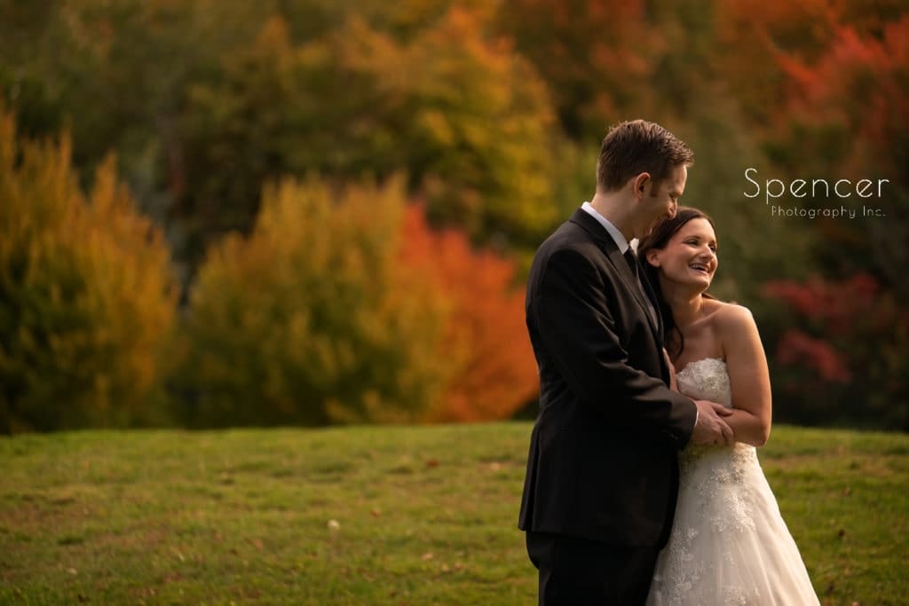bride and groom laughing before wedding at Stonewater Gold Club