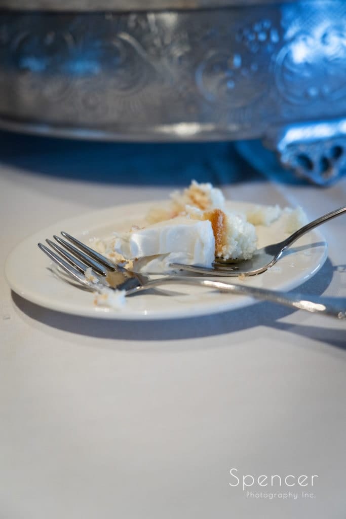 cut wedding cake at Firestone Reception