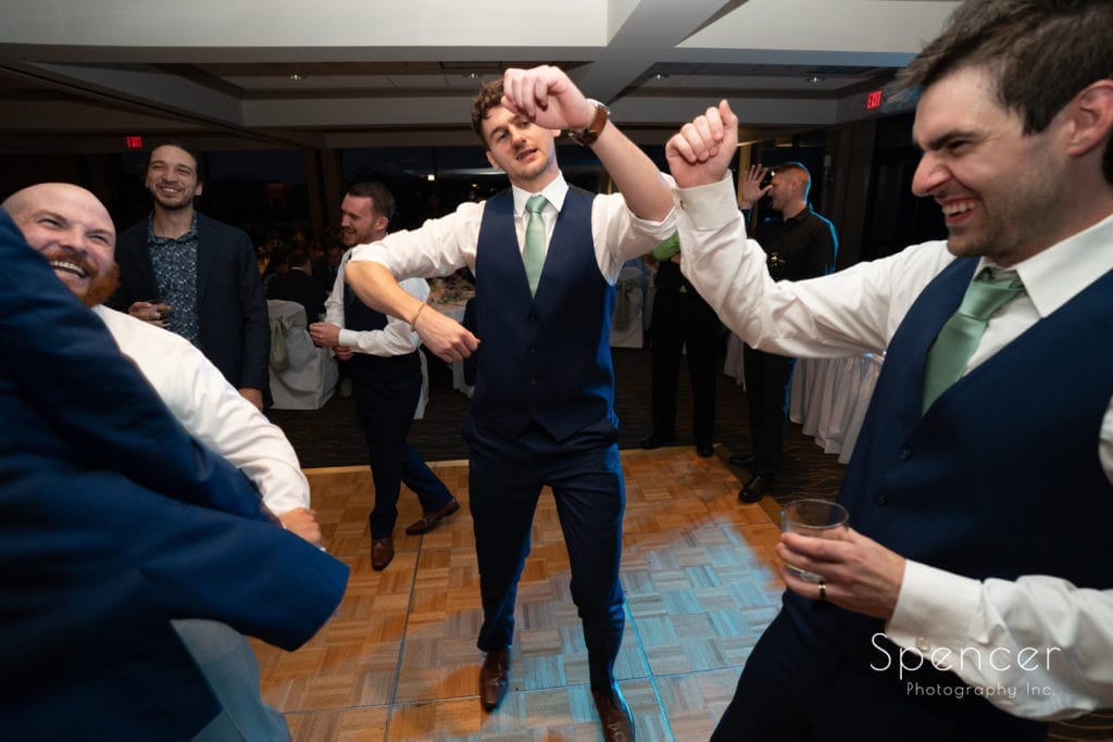 groom dancing at his wedding reception