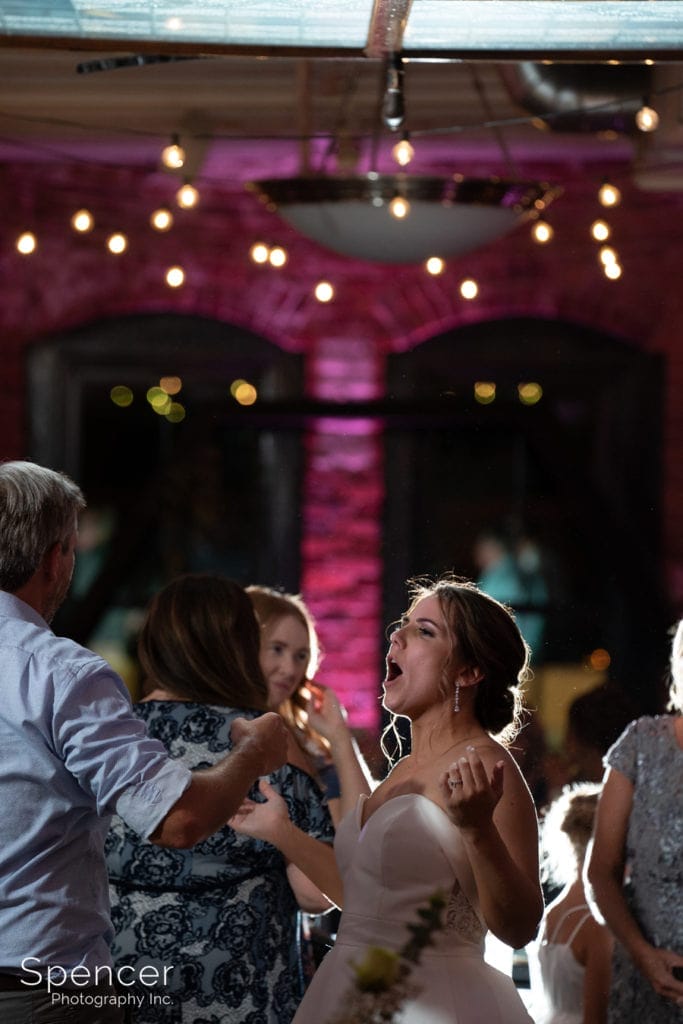 bride singing at her wedding reception at Great Lakes Brewing