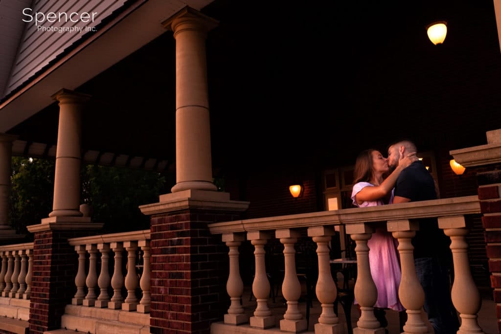 woman kissing man in engagement picture at south river winery