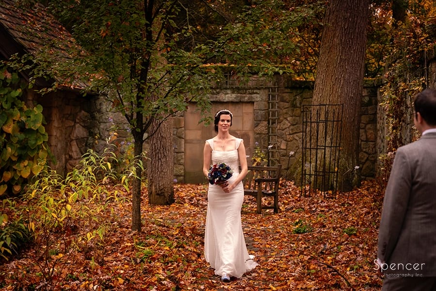 bride seeing groom before fall wedding at Stan Hywet