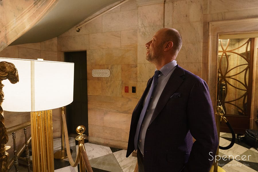 groom waiting for bride at Marble Room entrance